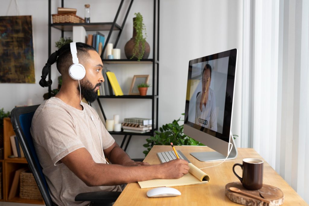 A young man on a remote work from home office space - Business trends in 2025